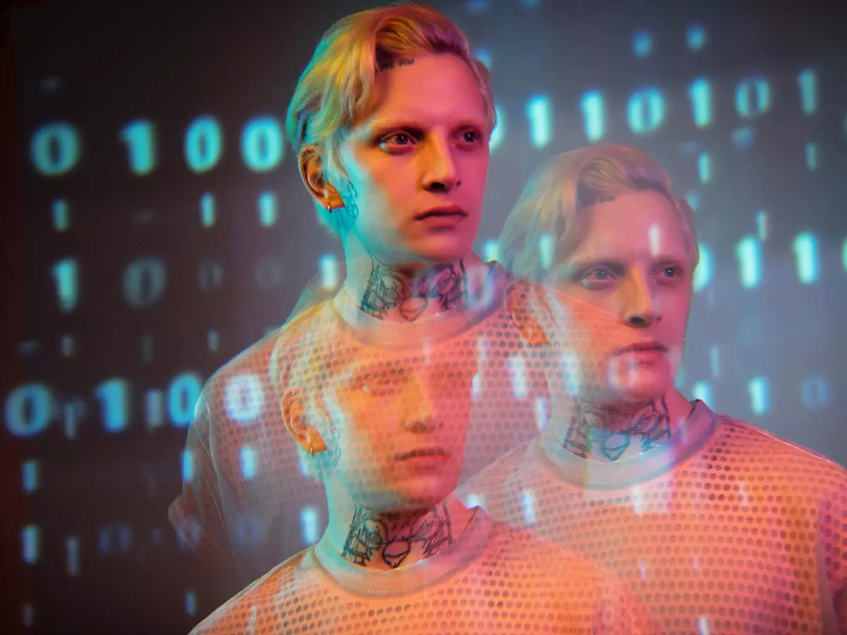 Three people stand against a backdrop of binary code, their faces blurred and overlapping, creating a sense of tension and complexity. The overall tone is enigmatic.